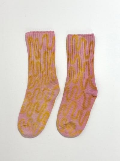 Image may contain Clothing Apparel Footwear Shoe Sock and Knitting