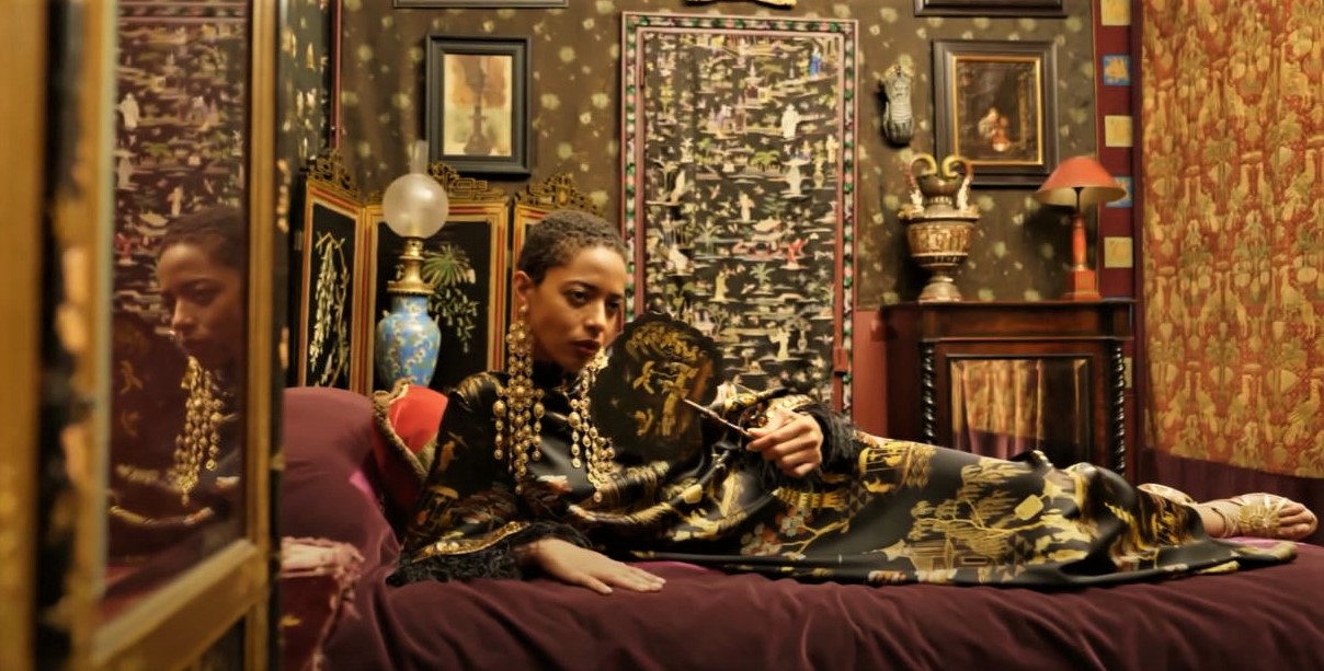 Andrew Gn chinese gown on bed horizontal Paris 2 video (2) cropped.JPG