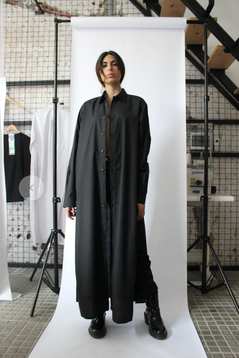 A person wearing a black coat

Description automatically generated with low confidence