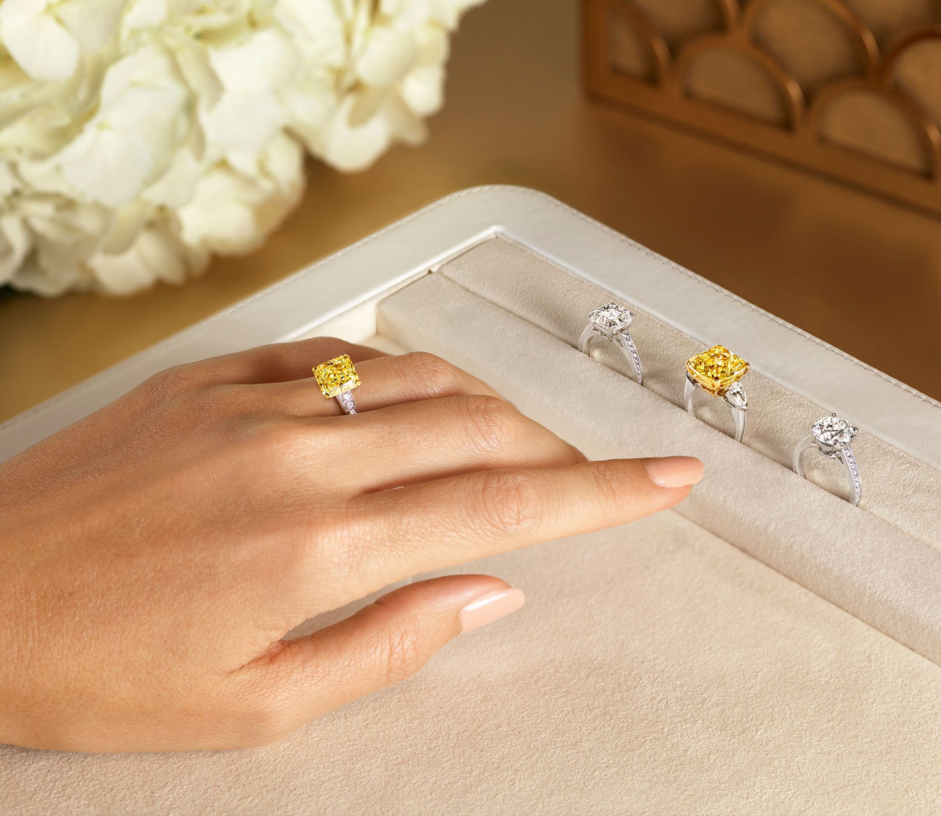 a-lady-wearing-a-yellow-graff-diamond-ring-1900x1647.jpeg