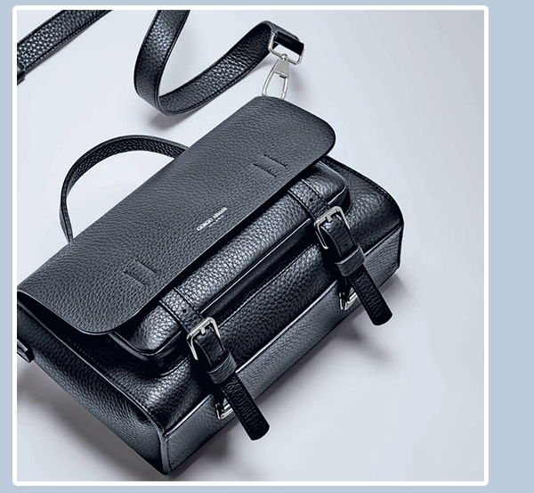 A black handbag with a strap Description automatically generated with low confidence