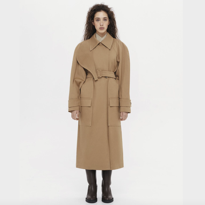 A person wearing a long coat Description automatically generated with low confidence