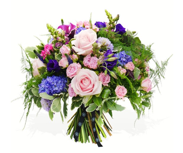hand tied pleasing purple bouquet of hyacinths, hydrangeas, lisianthus and snapdragons