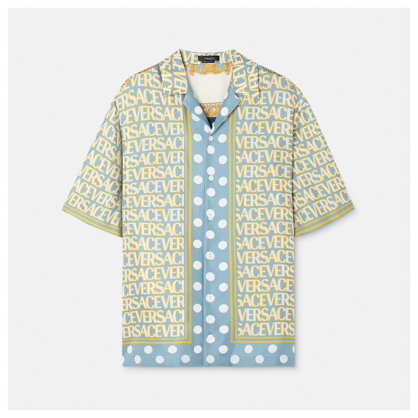 A blue and yellow shirt with white dots Description automatically generated