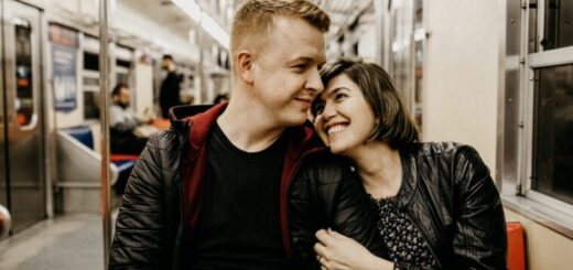 a person and person sitting on a subway descripti