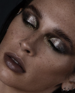 A person with glittery makeup Description automatically generated