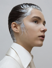 A person with white paint on their hair Description automatically generated