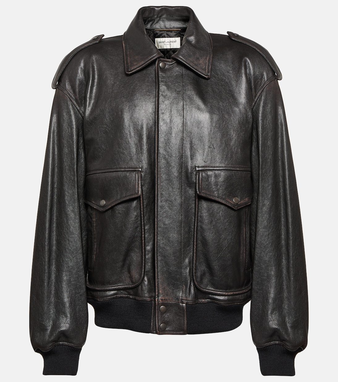 A black leather jacket with shoulder straps Description automatically generated