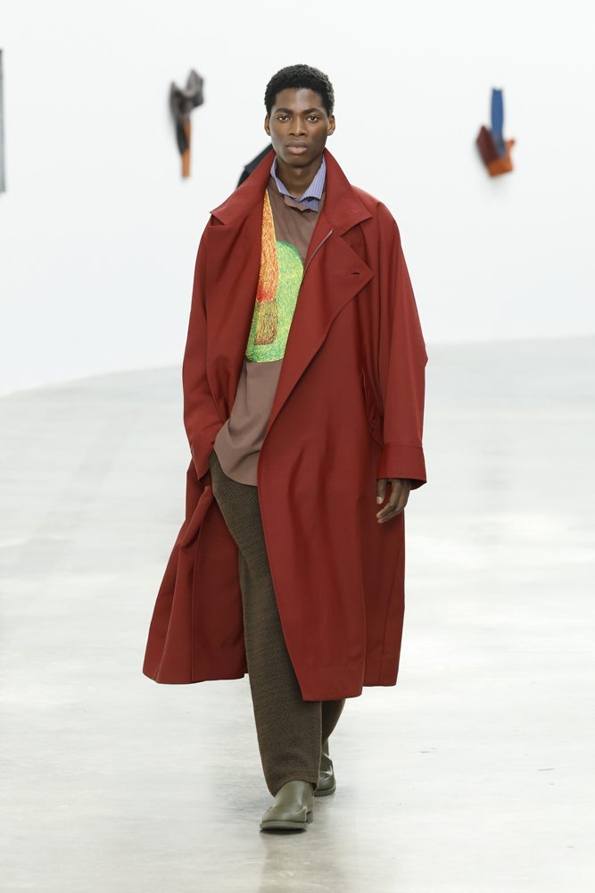 A person in a red coat Description automatically generated