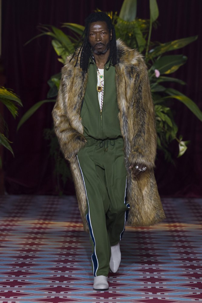 A person wearing a fur coat Description automatically generated
