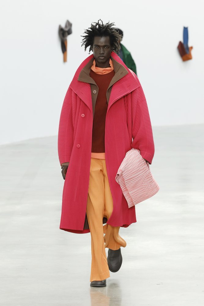A person wearing a red coat Description automatically generated