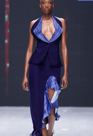 A deep V-neckline is mimicked in a sexy slit. At Emily Kasbit